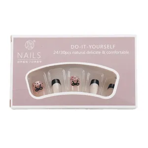 Gothic dark cat-eye press-on nails set with black polka dots and butterfly bows