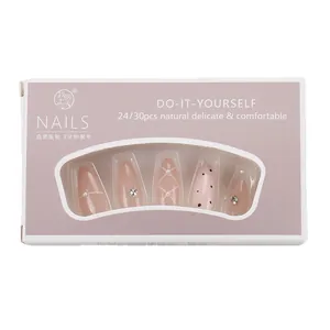 Pink press-on nails with plaid patterns and rhinestones in water drop shape