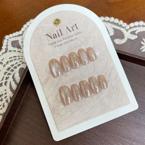 Short oval cat-eye press-on nails in nude pink with aurora pearl finish on display card