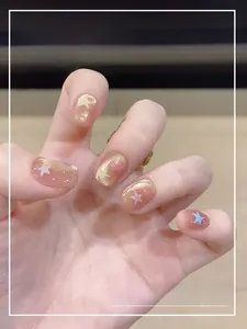 Macro detail of handmade pink cat-eye press-on nails with colorful glitter stars