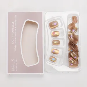 Detail of handmade cat eye nails with colorful star patterns and glass bead finish