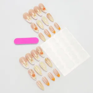 Handmade 3D floral almond press-on nails set with nude pink base and summer petal art
