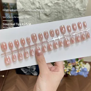 Short oval cat eye press-on nails in nude pink color with natural polarized shimmer