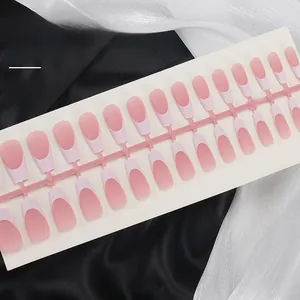 Matte pink blush press-on nails set with medium trapezoid shape on silk fabric background