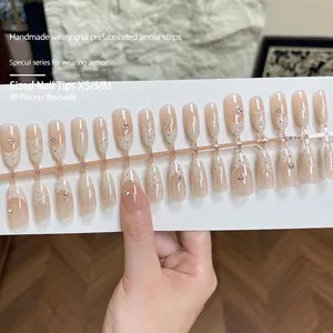 30pcs handmade press-on nails in nude pink gradient almond shape with pearl and bow design