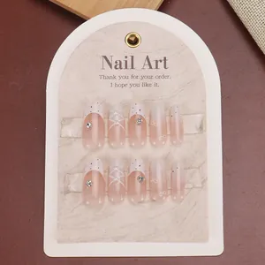 Elegant almond press-on nails with nude gradient, 3D bows and pearl accents