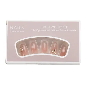 Cat eye press-on nails with gradient glass beads and golden butterfly accents
