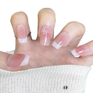 Handgefertigte rosa French Press-on Nails mit Farbverlauf und süßer Schleifendekoration
