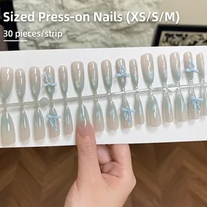 Long coffin cat eye press-on nails with blue 3D bows and gradient Morandi green finish