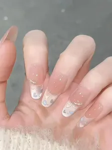 Close-up of heart pattern oval press-on nails with soft macaron colors and glitter finish
