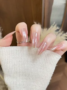 Detail of glossy aurora gradient coffin nails with shimmering pearlescent finish