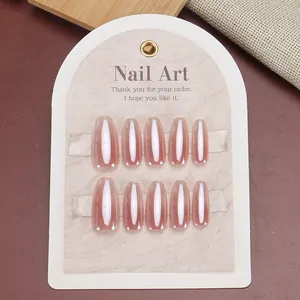 Nude pink blush gradient almond press-on nails set with high gloss finish on display card