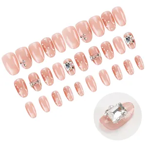 Faux ongles rose nude effet œil de chat avec nœuds 3D et strass, kit de 24 pièces
