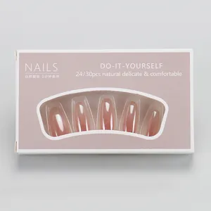 Macro shot of blush gradient fake nails in a white window box packaging set