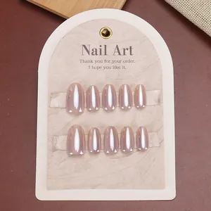 Handmade press-on nails set with gradient cat-eye effect in soft nude pink almond shape