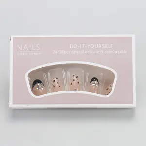 French leopard print press-on nails with silver butterfly charms in product packaging