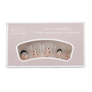 Handmade leopard print press-on nails with metal butterfly charm and caramel French design