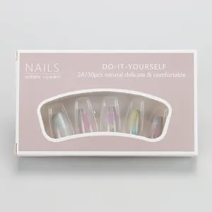 Detail view of macaron gradient press-on nails with rainbow star patterns in packaging