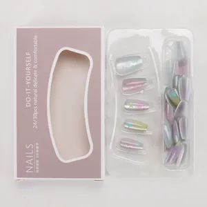 Detail showing macaron rainbow gradient press-on nails with shiny stars in window box