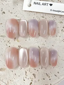 Macro detail of short oval press-on nails featuring purple and pink gradient with shimmer
