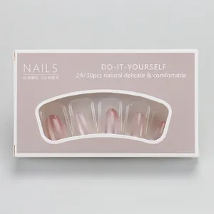 Detail of gradient pink-purple oval press-on nails with cat eye shimmer in window box