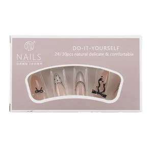 Long almond press-on nails with French retro black polka dots, lace, and pearl bows