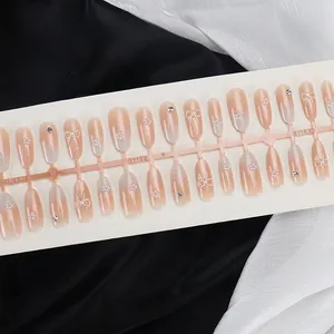 Close-up of handmade press-on nails with 3D bows, pearls and pink cat-eye gradient effect