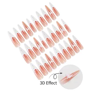French lace press-on nails with 3D pink bows and peach gradient long stiletto shape