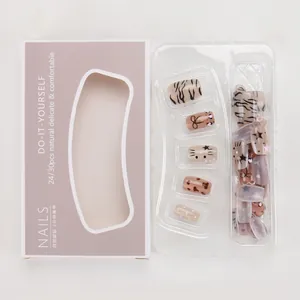 DIY nail kit details showing leopard print, bow, and star patterns in premium packaging
