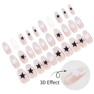 Pink gradient press-on nails with 3D pearl stars and black star patterns on white background