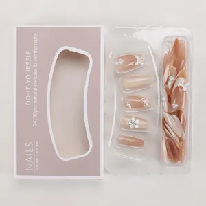 Detailed view of handmade press-on nails featuring 3D flowers, pearls and bow-knot designs