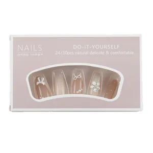 Handmade press-on nails with 3D white bows, pearls and flowers in a lavender box