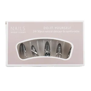 Handmade long cat eye press-on nails with silver black gradient and rhinestone accents
