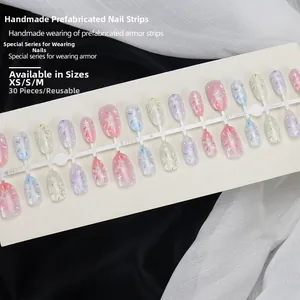 Detail of 30pcs gradient macaron star press-on nails in XS/S/M sizes on a display card