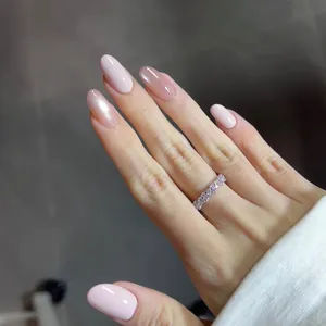 Pale pink and nude brown gradient press-on nails with shiny pearl finish and ring detail