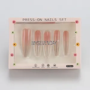 Detailed view of pink ombre coffin press-on nails set in professional retail packaging