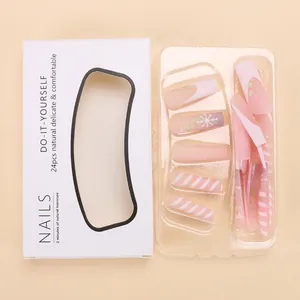 Detail view of 24pcs pink Christmas press-on nails with snowflakes and white stripe patterns