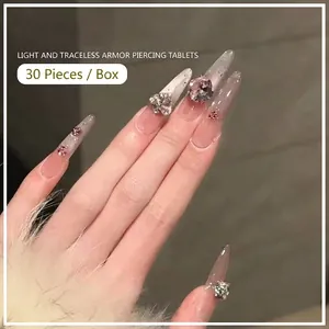French style stiletto press-on nails with luxury crystals and nude gradient finish