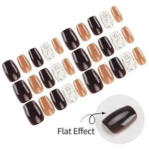 Short press-on nails in mocha brown and speckled white marble pattern for women