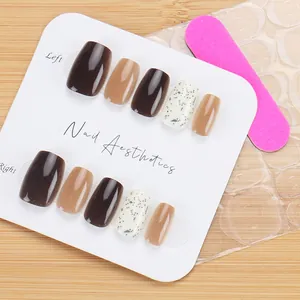 Short press-on nail kit with brown marble design, nail file and adhesive glue included