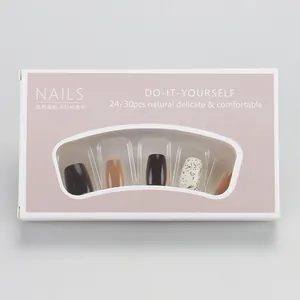 Short square press-on nails set in brown and white ink-splatter style with 24-30 pieces