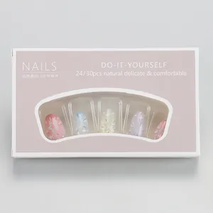 Short macaron gradient press-on nails with star glitter in clear window gift packaging
