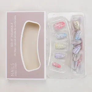 Detail view of macaron gradient press-on nails set with glitter stars and DIY kit