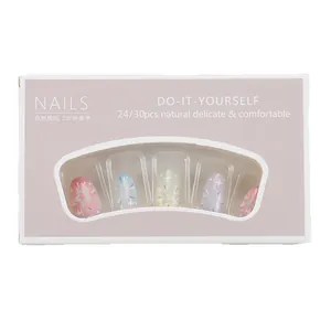 Short macaron gradient press-on nails with star patterns in transparent window box