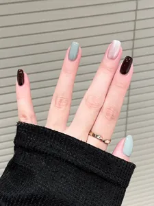 Short square press-on nails in burgundy, sage green, and pink gradient colors