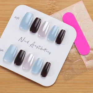 Detail view of short Morandi nails with cat eye shimmer effect and application tools
