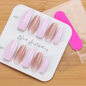 Macro shot of 10 gradient lavender and nude pink press-on nails with tool kit