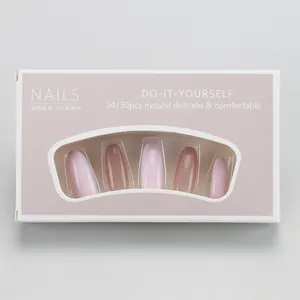 Detail of DIY press-on nails packaging showing gradient pink pearlescent finish and 24-piece set