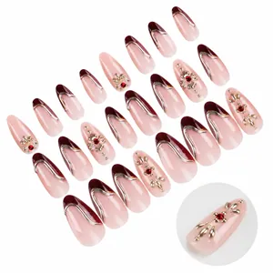 Almond fake nails in nude pink and burgundy with silver 3D embossed lines and rhinestones