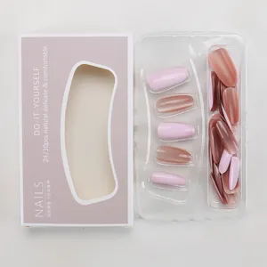 Detail of pink and purple cat-eye press-on nails in professional packaging box